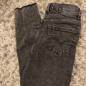 Black stretchy Levi’s mom jeans with fringe